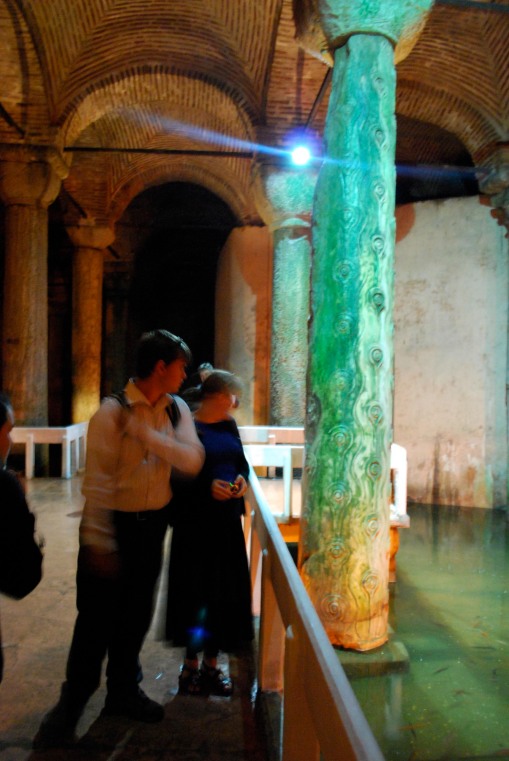Charlie and Kate examine a strange column in the cistern.